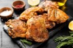 Grilled chicken thighs with spices and lemon.