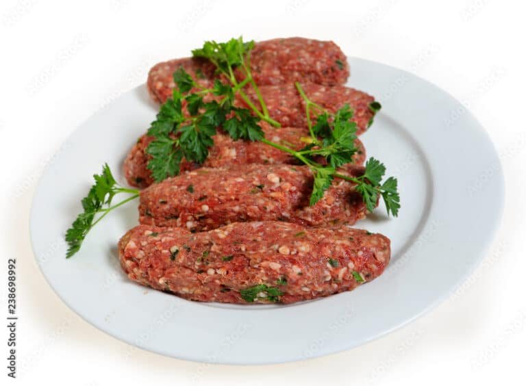 Raw lamb kofta on a plate