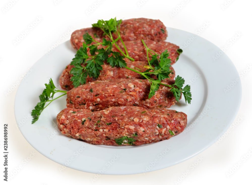 Raw lamb kofta on a plate