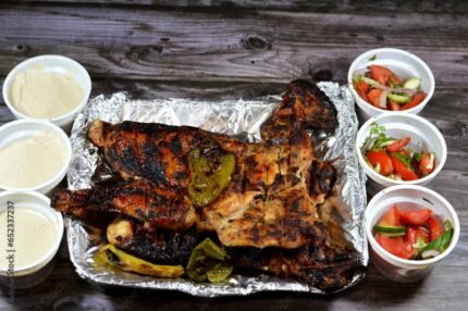 Traditional Arabic cuisine food beef Kofta and tarb kofta shish, minced meat charcoal grilled, chicken grilled and roasted on a charcoal grill Mesahab, Egyptian rice with vermicelli and Eastern salads