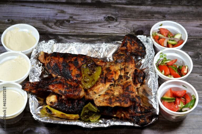 Traditional Arabic cuisine food beef Kofta and tarb kofta shish, minced meat charcoal grilled, chicken grilled and roasted on a charcoal grill Mesahab, Egyptian rice with vermicelli and Eastern salads